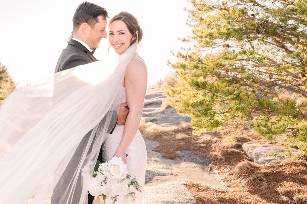 A loving elegant couple getting married on a warm spring day at The Cliffs at Glassy Chapel by JoLynn Photography