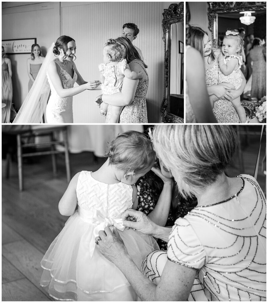 A bride getting ready with her family on her wedding day by JoLynn Photography