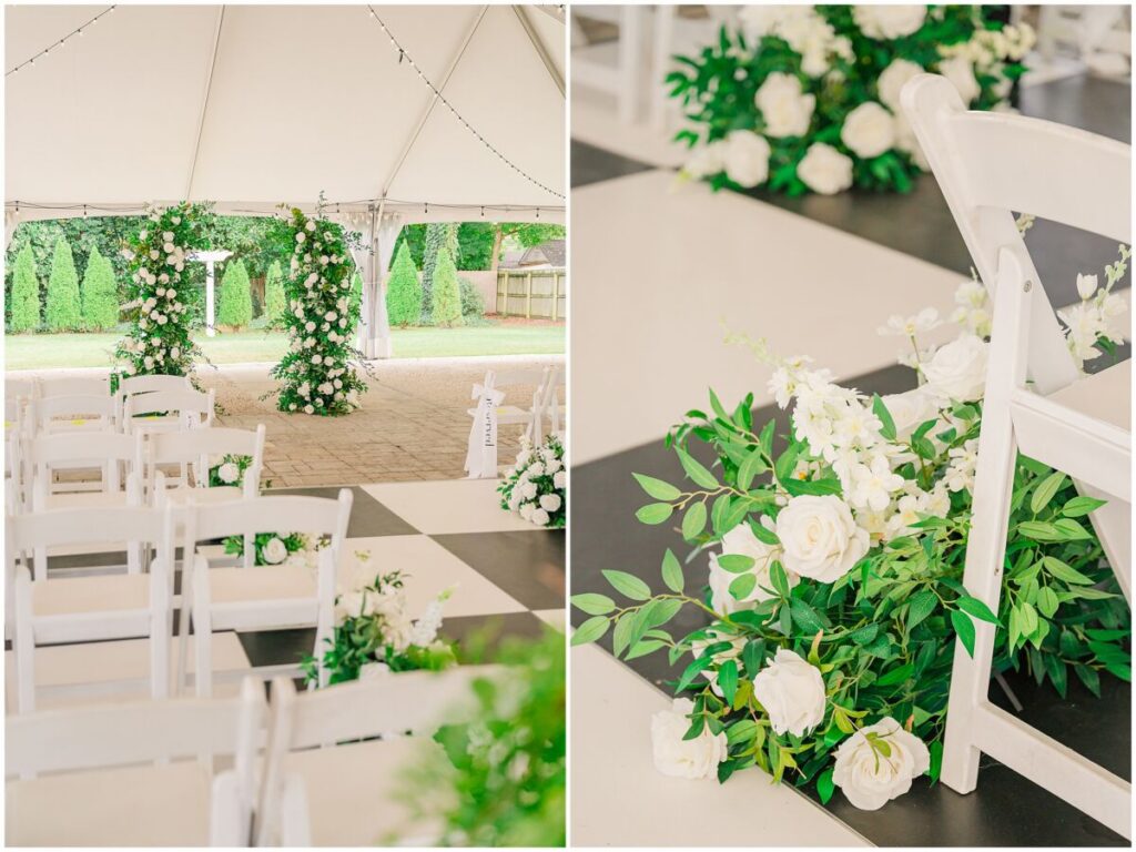 Gorgeous wedding reception details of bright greenery, white roses, and pops of black that line the aisle at The Finch House by JoLynn Photography