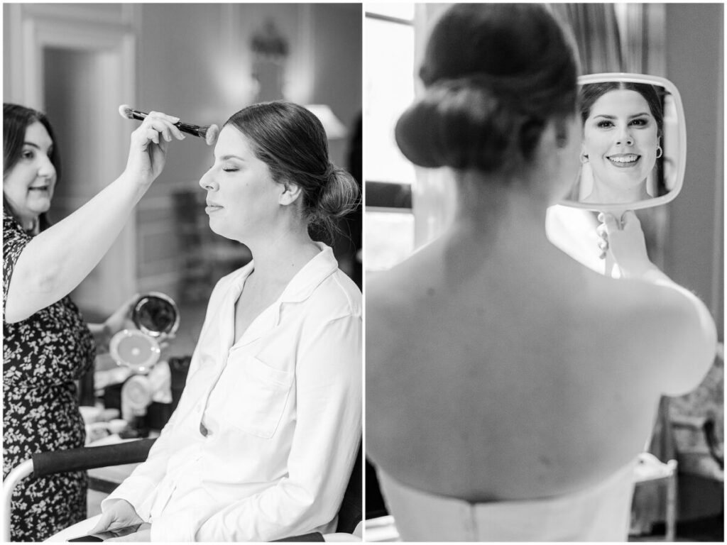 A happy bride getting ready on her wedding day in a black and white photo