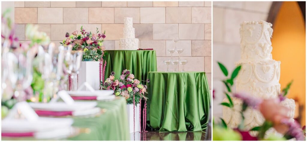 A stunning white three tiered cake surrounded by green and red wedding reception details at Dover Hall Estate