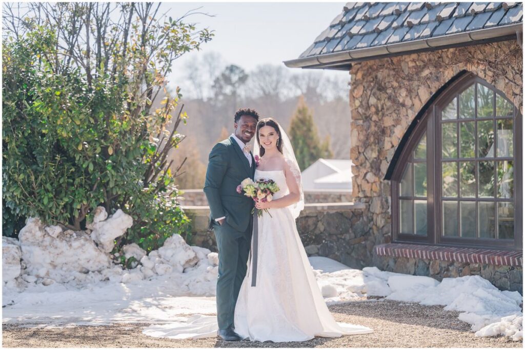 A happy couple enjoying their February portrait session at Dover Hall Estate by JoLynn Photography
