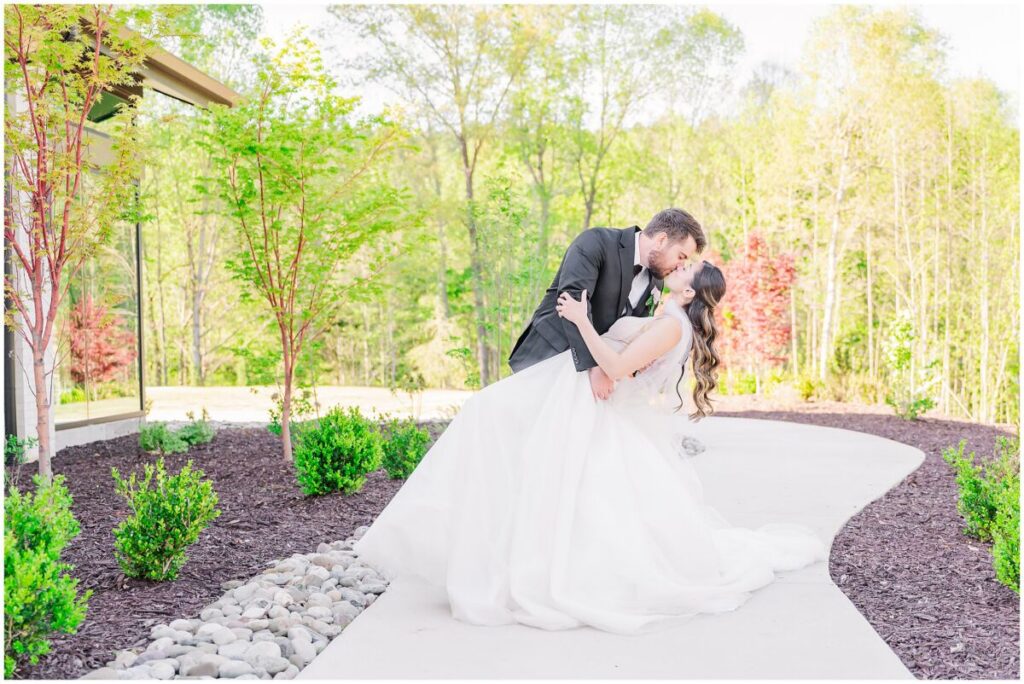 Stunning bridal portraits on a pretty pathway at The Skyroom during a spring afternoon.