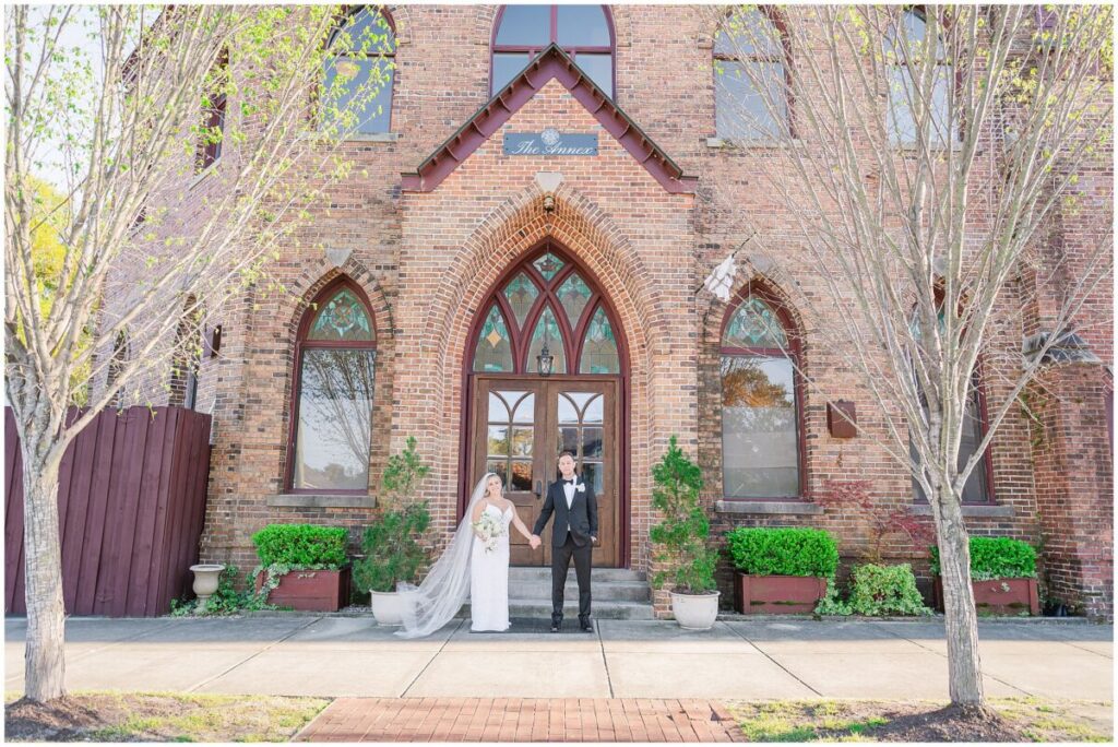 A happy couple enjoying their portraits during their Brooklyn Arts Center wedding day by JoLynn Photography