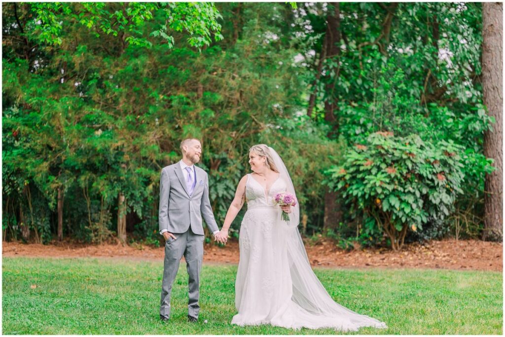 A happy couple on their summer wedding day in a beautiful green park at sunset at Terra Blooms Farm by JoLynn Photography