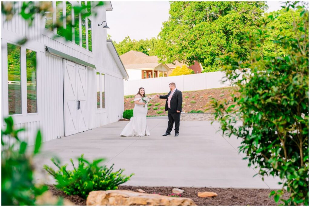 A happy couple during golden hour portraits at The Barn at Blue Sky Farm by JoLynn Photography