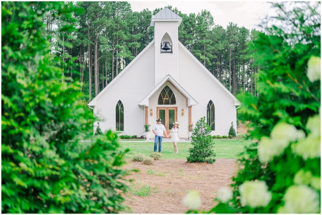 Glowing summer portraits at the chapel during a beautiful afternoon during a Pavilion at Carriage Farm engagement by JoLynn Photography