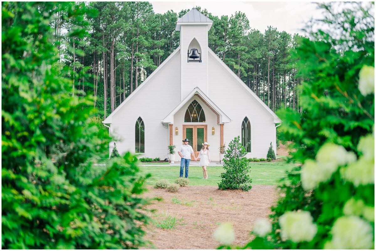 Glowing summer portraits at the chapel during a beautiful afternoon during a Pavilion at Carriage Farm engagement by JoLynn Photography