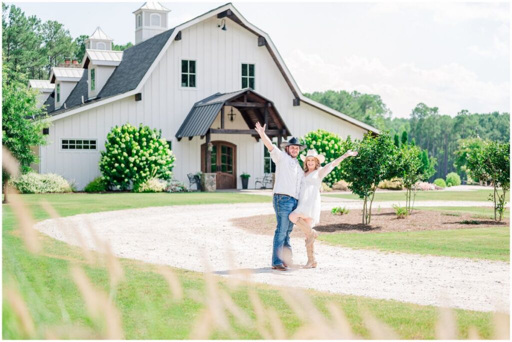 Laughter under the summer sun during a beautiful Pavilion at Carriage Farm engagement session by JoLynn Photography