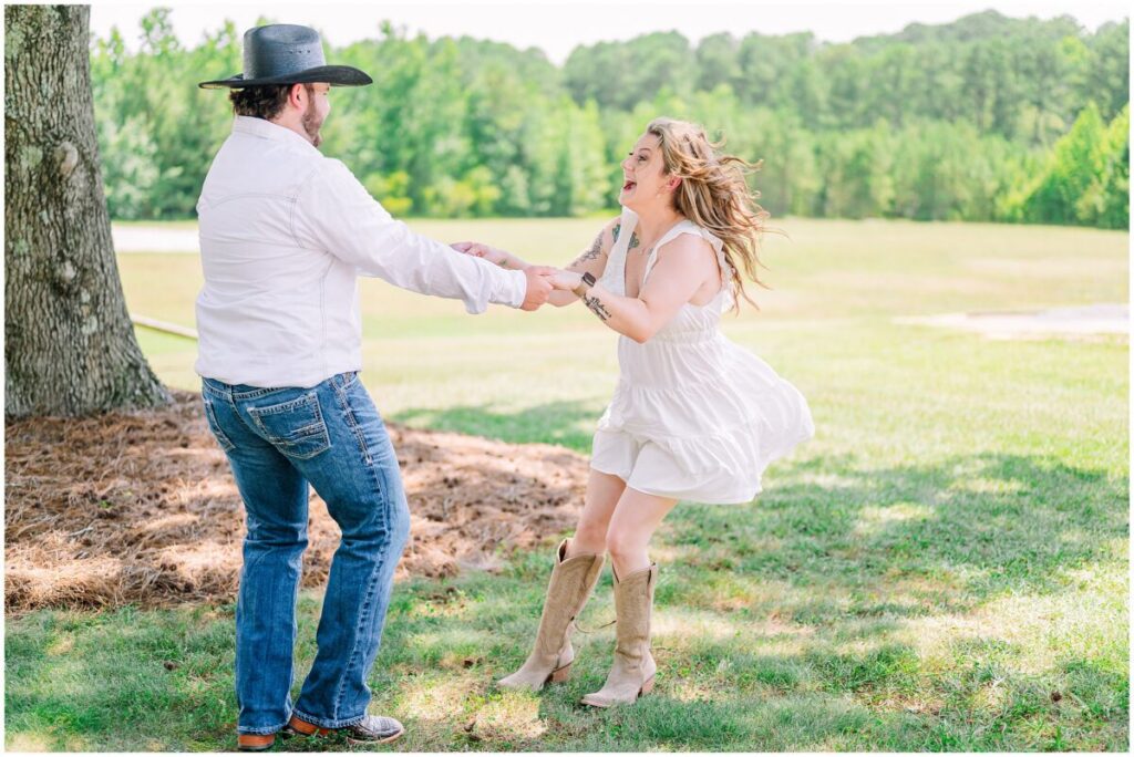 Laughter under the summer sun during a beautiful Pavilion at Carriage Farm engagement session by JoLynn Photography