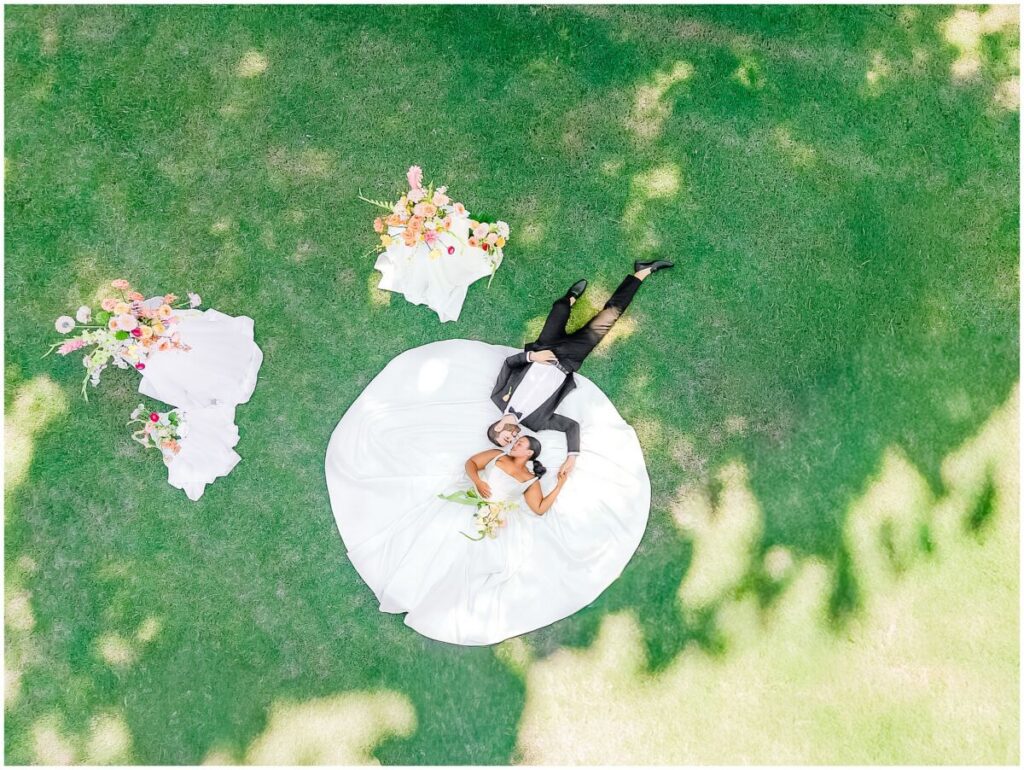 A fun drone portrait on a happy couples summer wedding day at Stone Manor by JoLynn Photography
