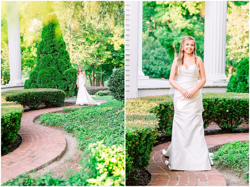 A Rose Hill Estate bridal portrait of a glowing bride walking through an evergreen garden on a stunning brick pathway by JoLynn PHotography