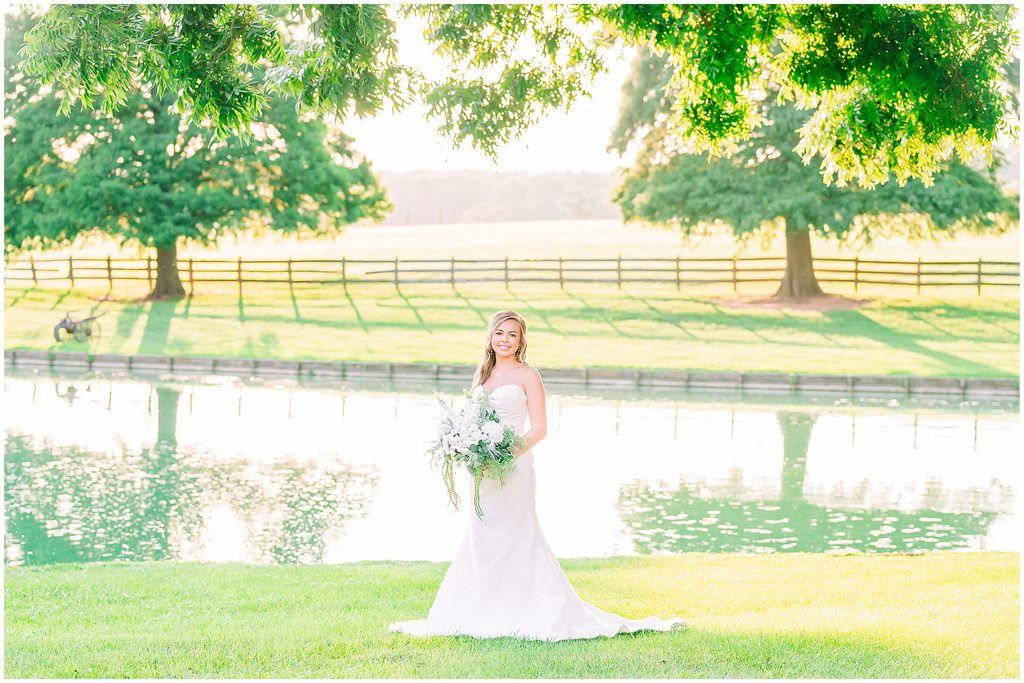 A stunning Rose Hill Estate bridal portrait during a summer sunset overlooking the water during a dreamy session by JoLynn Photography