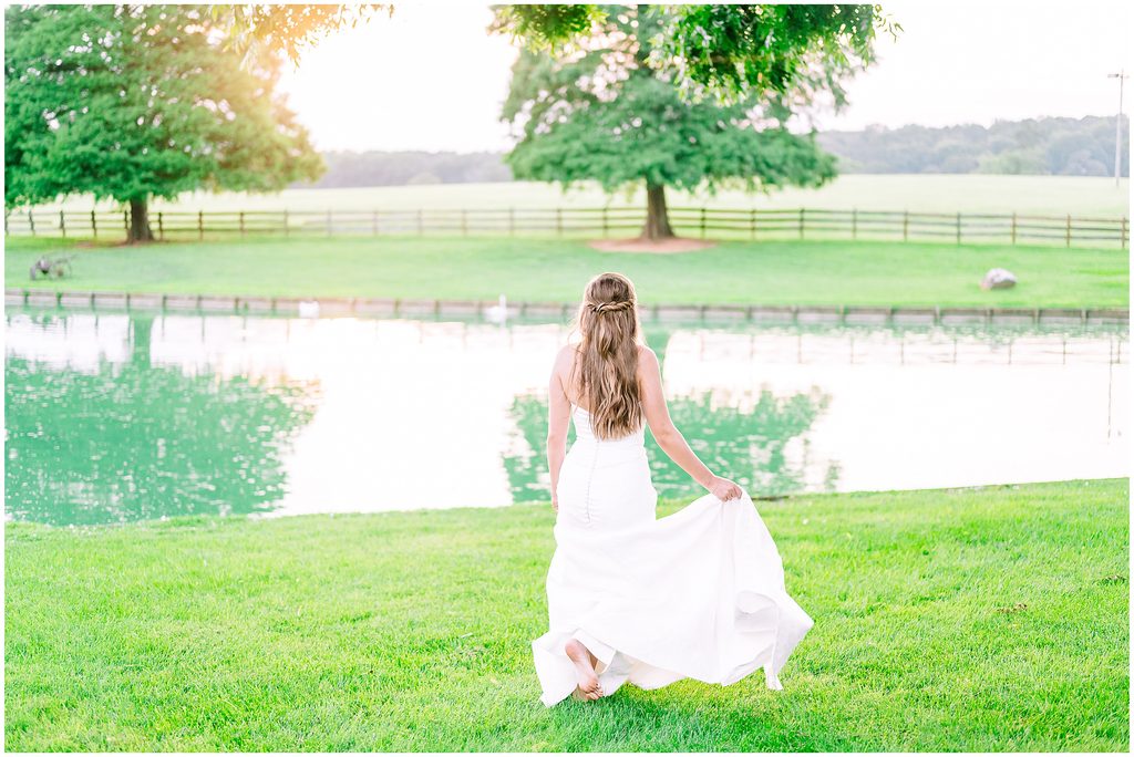 A carefree bride running barefoot along the waterway at sunset after her perfect Rose Hill Estate bridal portrait session by JoLynn Photography